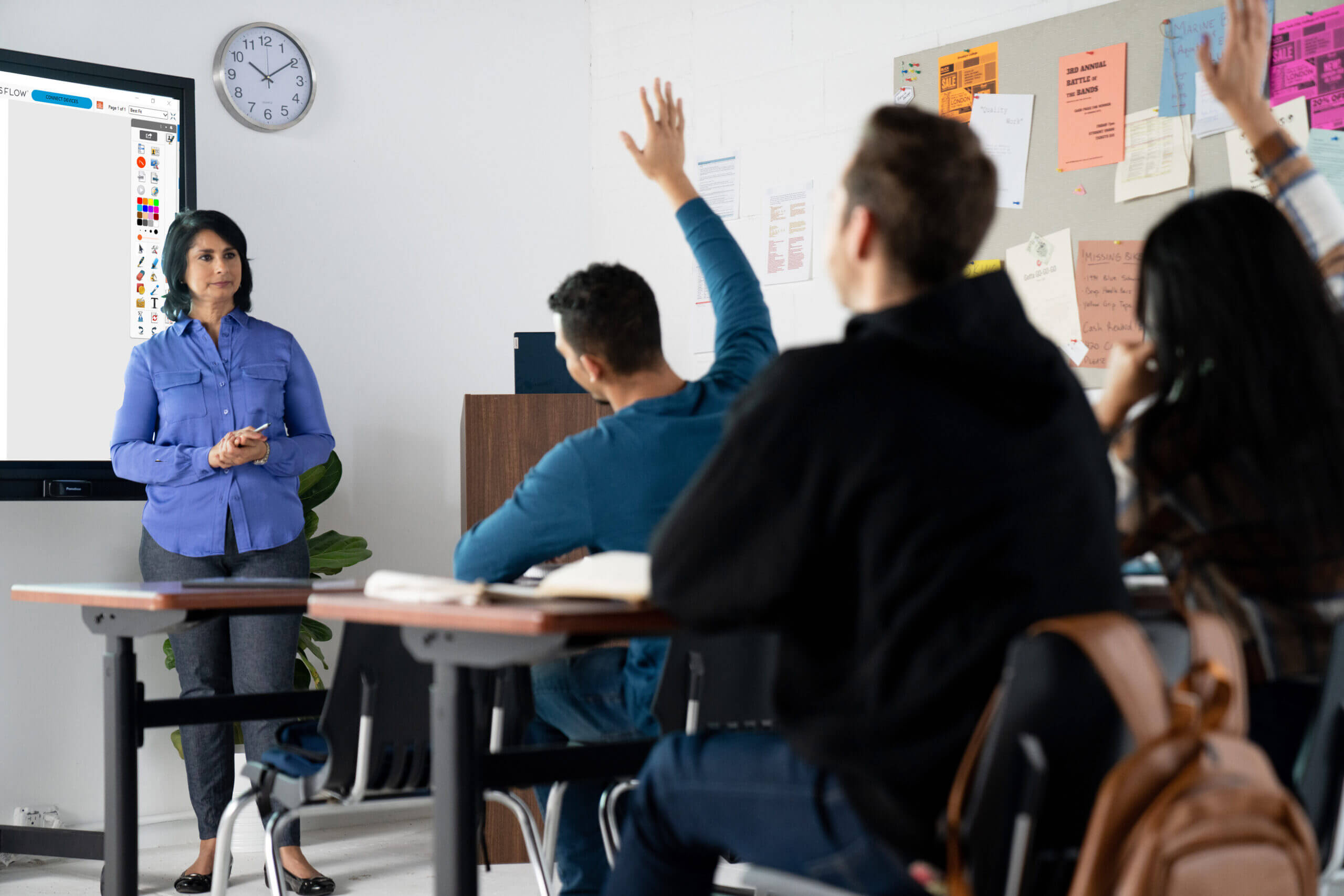 Teacher in front of Higher education class using ActivInpsire Software