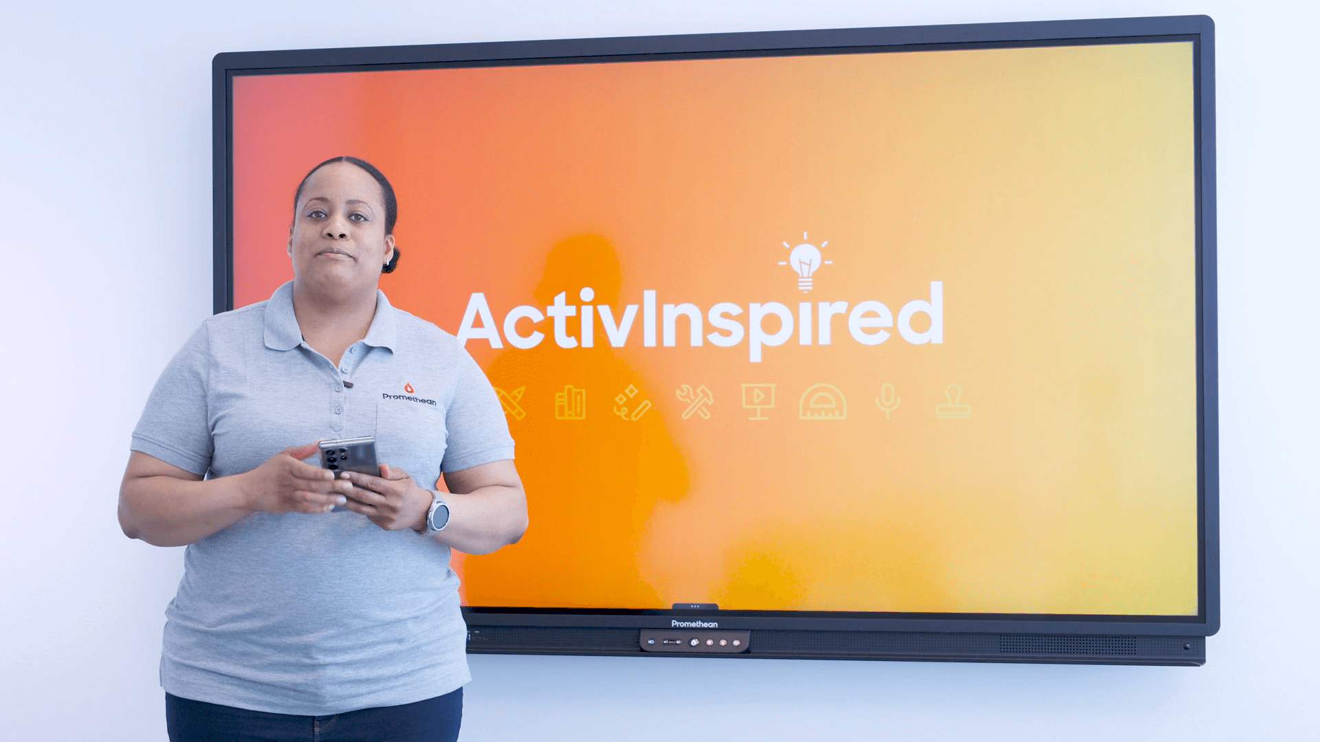 An instructor in front of a Promethean Panel instructs on getting started with ActivInspire.