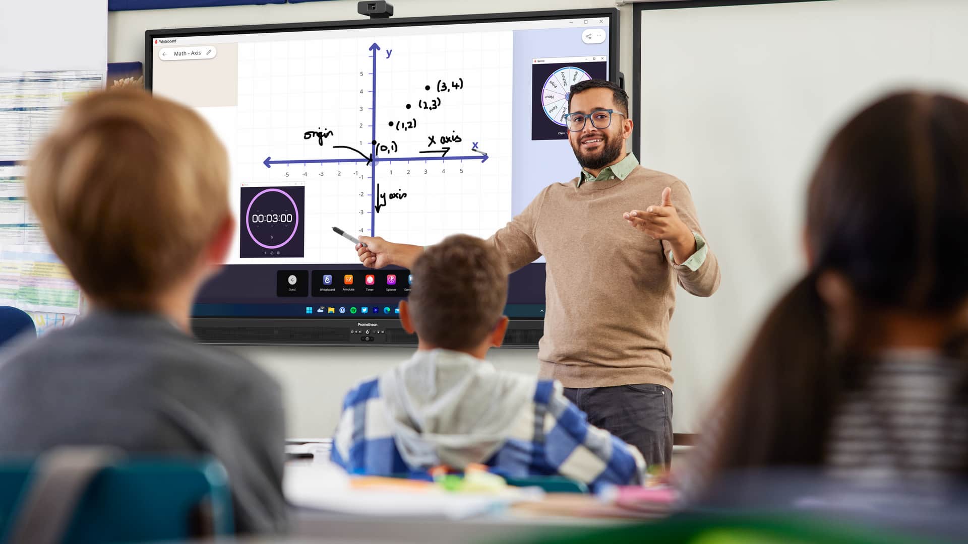 A teacher uses Promethean ActivSuite Whiteboard, Timer, and Spinner to teach a math lesson.